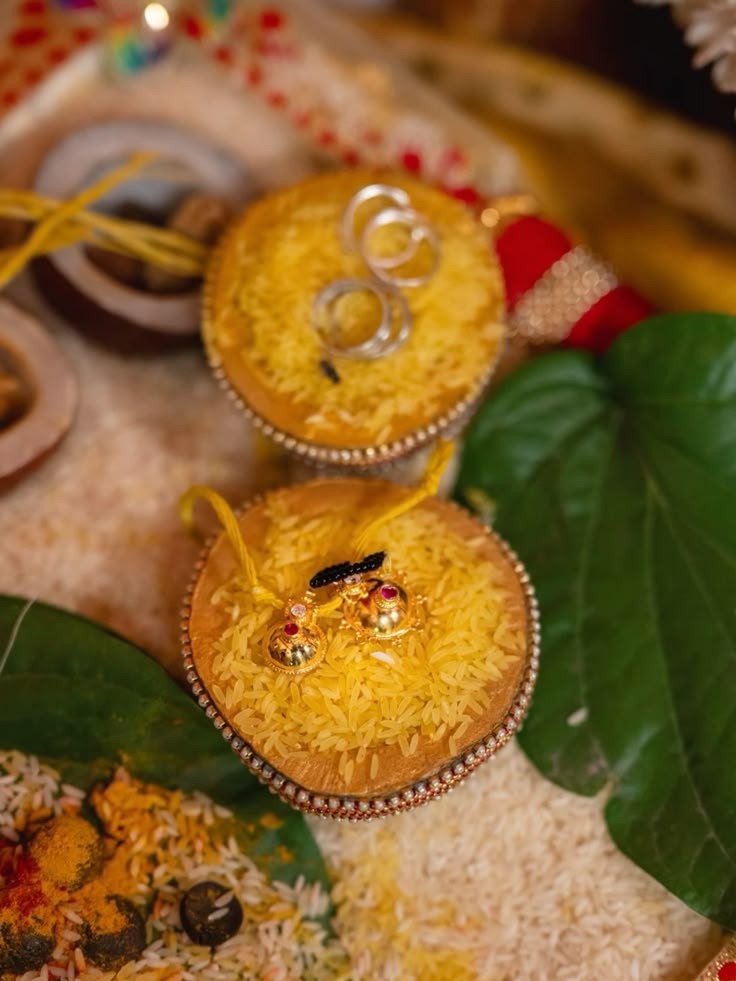 Smiling South Asian couple, woman wearing cream sari with golden embroidery and man wearing blue checkered casual shirt in front of a smooth bright orange blend organic shape background